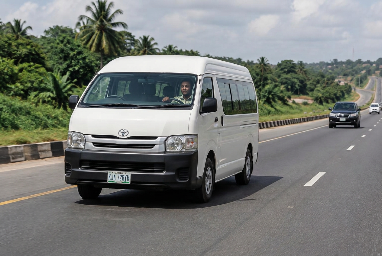 Illustrative interstate travel scene: a passenger minibus traveling along a highway through tropical countryside